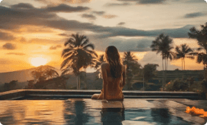 Woman sitting at the edge of a pool